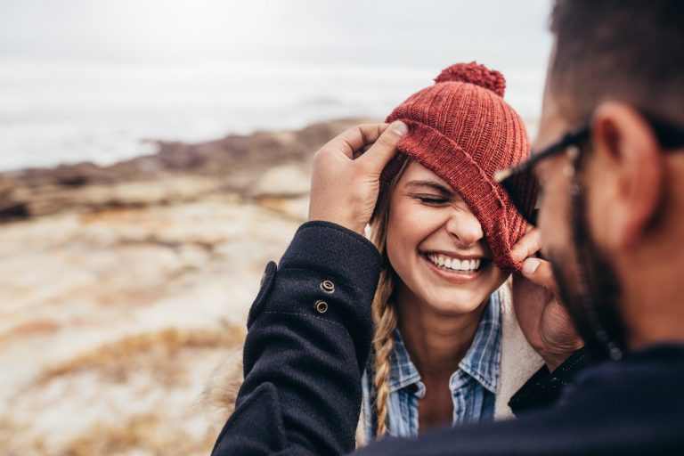 Close,Up,Portrait,Of,Smiling,Young,Couple,Having,Fun,Outdoors.